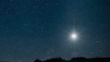 The star shines over the manger of christmas of Jesus Christ.